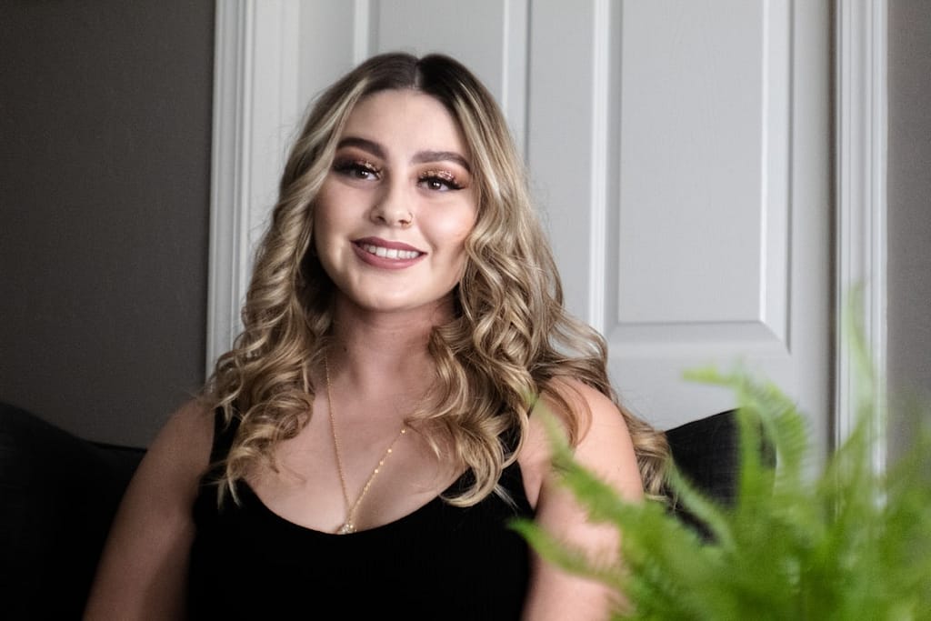 Young woman with a confident smile, representing accessible lip filler treatment and flexible payment options at Sakura Skin