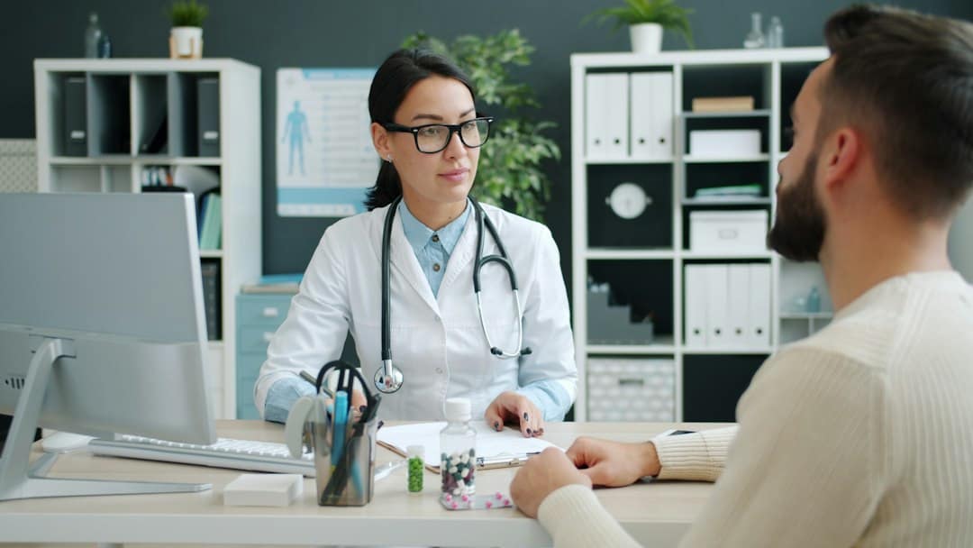 Provider talking with a patient and taking notes at a first Botox appointment