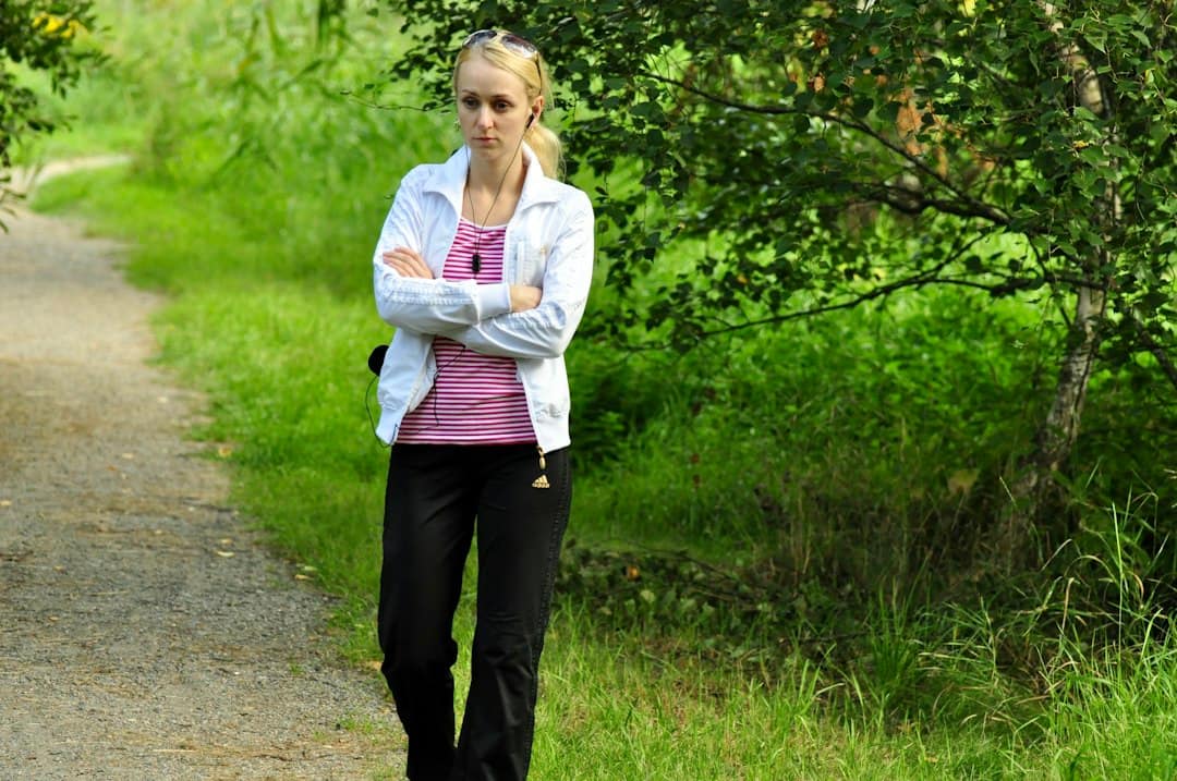 Woman outdoors on a path, considering whether hormone pellet therapy is right for her