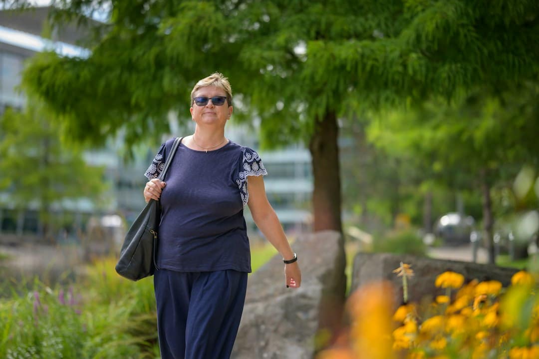 Woman walking outdoors, staying active to prevent weight regain after stopping GLP-1